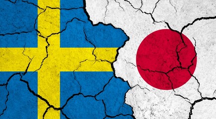 Flags of Sweden and Japan on cracked surface - politics, relationship concept