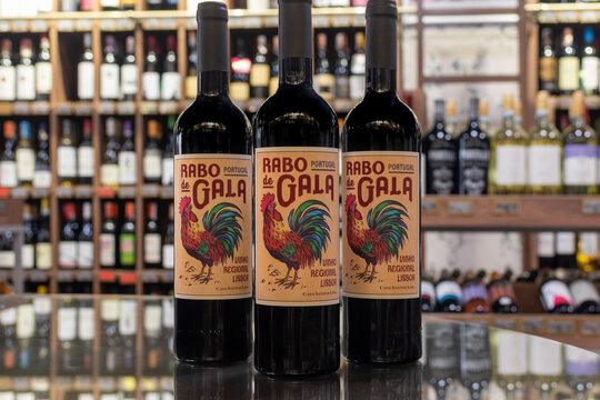 Bottles of Portugal red wine Rabo de Gala Vinho Regional Lisboa close-up on blurred background of wine shelves. Ukraine, Zhytomyr, August, 2, 2023