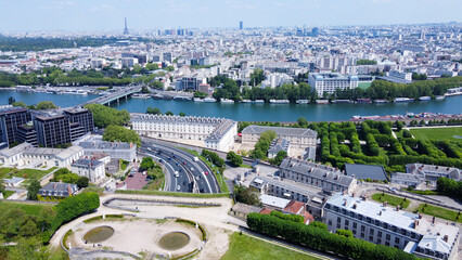 Drone point of view on Seine river, Boulgne-Billancourt and Eiffel tower in distance