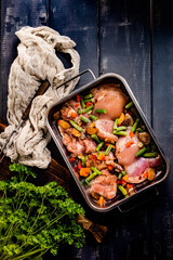 Prepared for baking chicken meat with vegetables.