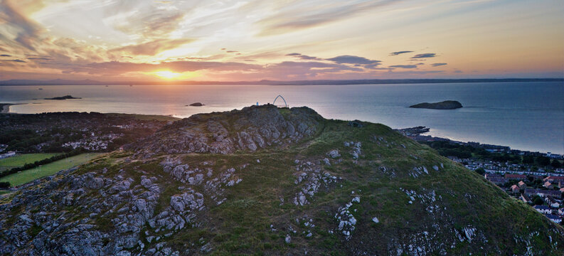 Aerial view of the whale bone monument on top North Berwick law in Scotland at sunset