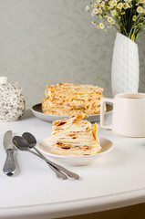 A piece of Napoleon cake. Layered cake with custard