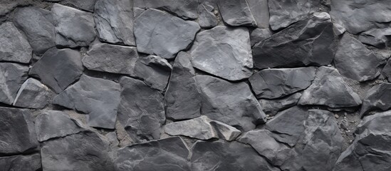 A high resolution top view image of a grey stone pattern on a concrete background, with copy space.