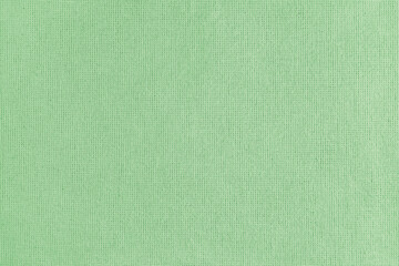 Texture background of green cotton fabric. Textile structure, cloth surface, weaving of linen...