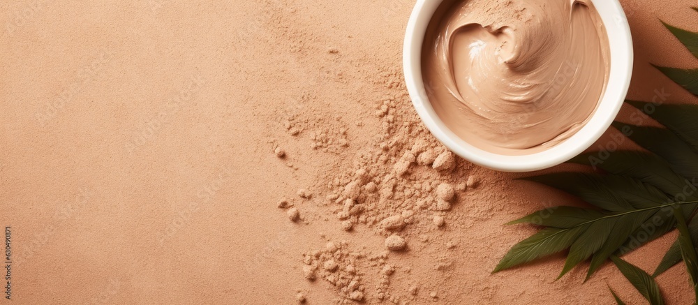 Poster Clay mask in a bowl for facial spa is placed on a beige background with a top view and copy space.