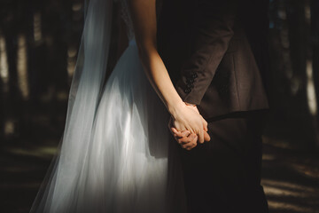 bride and groom holding hands - 630491688