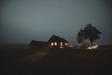 old house in the fog at night - Powered by Adobe