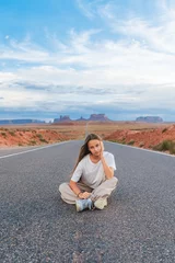 Outdoor kussens Scenic highway in Monument Valley Tribal Park in Utah. Happy girl on famous road in Monument Valley in Utah.  © travnikovstudio