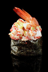 Ebi sushi with tiger shrimp, avocado and mayonnaise, on a black mirror. Close up