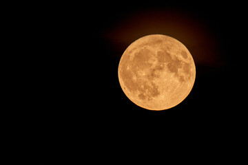 Full Orange Moon movement across the sky