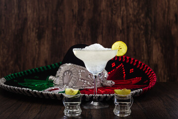 Margarita cocktail and mariachi hat in the background. Mexican symbols.