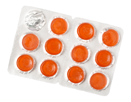 Red pills, medical capsules in aluminum strip packaging isolated on white, top view