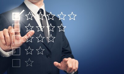 Business Man hand and five star sign to rating