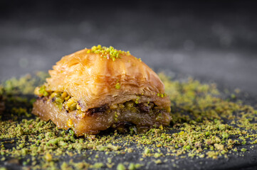 Traditional turkish dessert antep baklava with pistachio on rustic background. Desserts concept