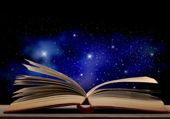 open retro antique book on desk and stars background