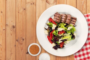 Tasty fresh salad with vegetables in plate