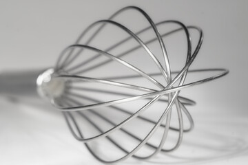 whisk,	egg whip,eggbeater, close up of kitchen tool,food and drink cooking conept