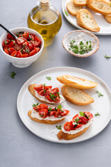 Tomato basil and cream cheese bruschettas with fresh cherry tomatoes