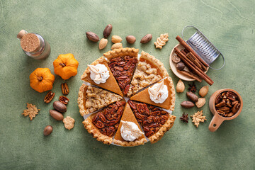 Variety of Thanksgiving pie slices on parchment paper © fahrwasser