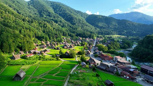 aerial view of traditional Japanese village of Shirakawago in summer, unique Japanese sightseeing spot in the mountains, Japanese culture, UNESCO World Heritage Site. High quality 4k footage
