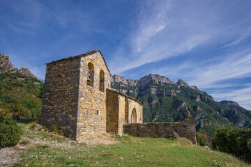 Fototapeta na wymiar Old abandoned chapel of Sercue Iglesia de San Miguel in Pyrenees mountains near Anisclo Canyon, Ordesa y Monte Perdido National Park, Huesca, Spain