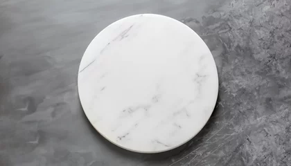 Fotobehang White empty marble texture round board on grey background. Top view. Copy space. © Uuganbayar