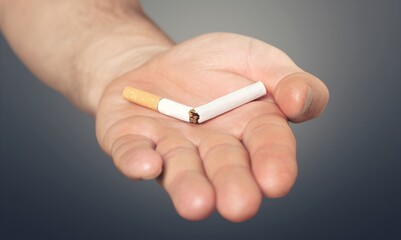 Stop smoking concept, Hand with broken cigarette