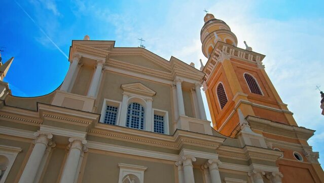 Amazing view of colorful Basilique Saint-Michel Archange de Menton. Baroque Roman Catholic basilica features artifacts in Menton, French Riviera.
