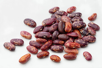 close up of red pinto beans isolated on white background.