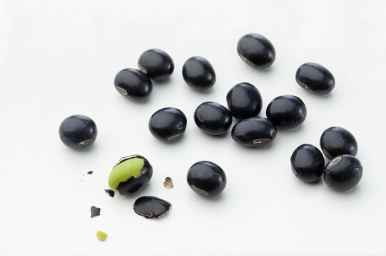 close up of black beans isolated on white background.