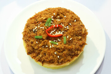 piece of cake on a plate. Beef floss Sponge Cake on white plate. high angle view.