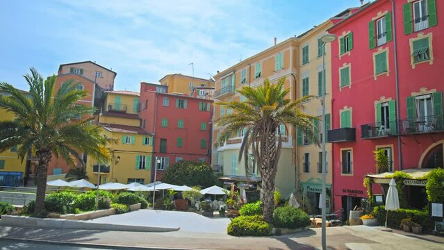 Panoramic scenic view of old colorful houses in Menton. View of colored restaurants on the French Riviera.