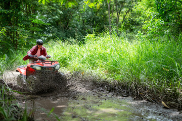 man riding atv vehicle on off road track ,people outdoor sport activities theme