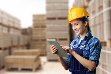 Worker person with laptop work in warehouse.