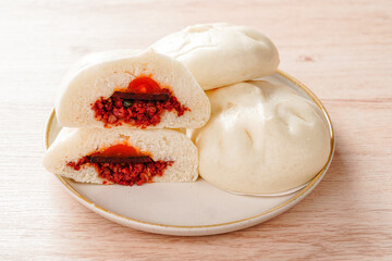 Baozi or Chinese Steamed Buns is a type of yeast-leavened filled bun in various Chinese cuisines.