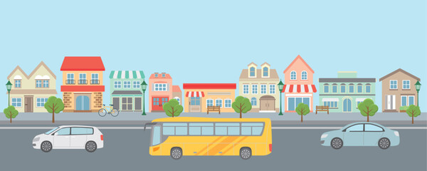 洋風な街並みを走る車とバス