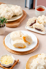 Obraz na płótnie Canvas Baozi or Chinese Steamed Buns is a type of yeast-leavened filled bun in various Chinese cuisines.