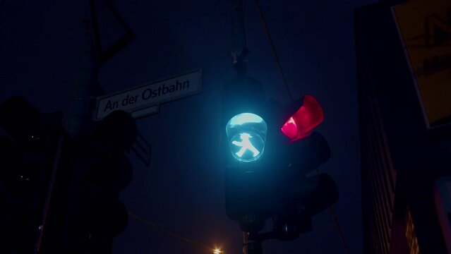 East Berlin Amplemann green stoplight traffic light symbol close up, night