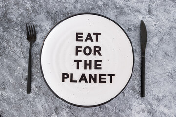 sustainable diet, Eat for the planet text on plate with fork and knife