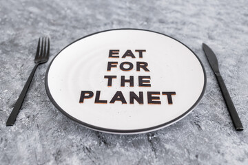 sustainable diet, Eat for the planet text on plate with fork and knife