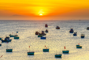 Mui Ne fishing village in sunset sky with hundreds of boats anchored to avoid storms, this is a beautiful bay in central Vietnam