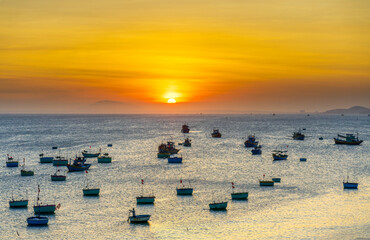 Mui Ne fishing village in sunset sky with hundreds of boats anchored to avoid storms, this is a beautiful bay in central Vietnam
