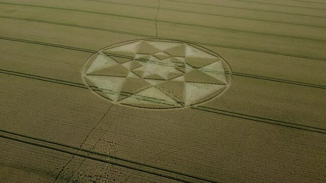 Micheldever crop circle 2023 aerial view establishing shot across wheat field and Hampshire countryside