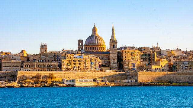 Valletta Malta city Skyline, colorful house balcony Malta Valletta, panoramic view over Valletta Malta old town at sunset