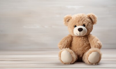 The plush teddy bear sat perched on the shelf, its button eyes gleaming with innocence