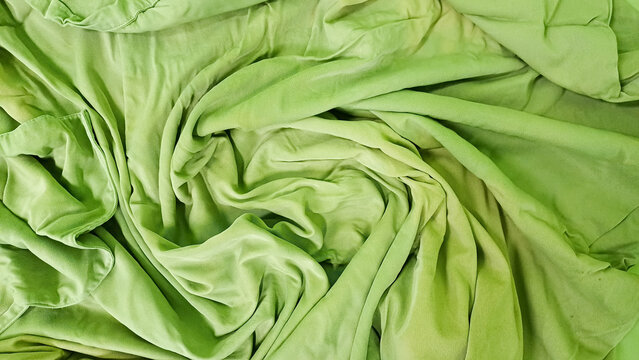 green wringkle messy blangket in the badroom in the morning,after sleeping in a long night 