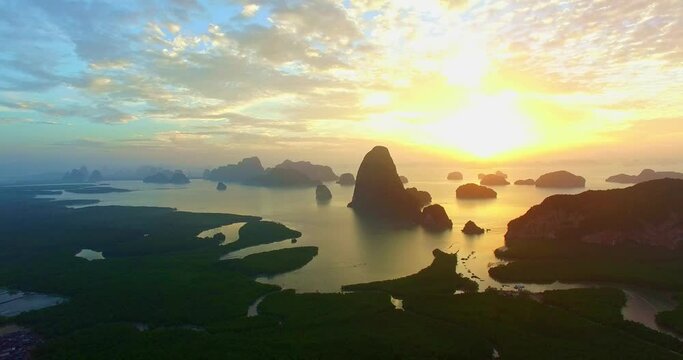 .Aerial view fantasy cloud scape in sunrise above Samed Nang Chee, Phang Nga .Imagine a fantasy bright red sky at sunrise from a bird's eye view. .archipelago background. sky texture