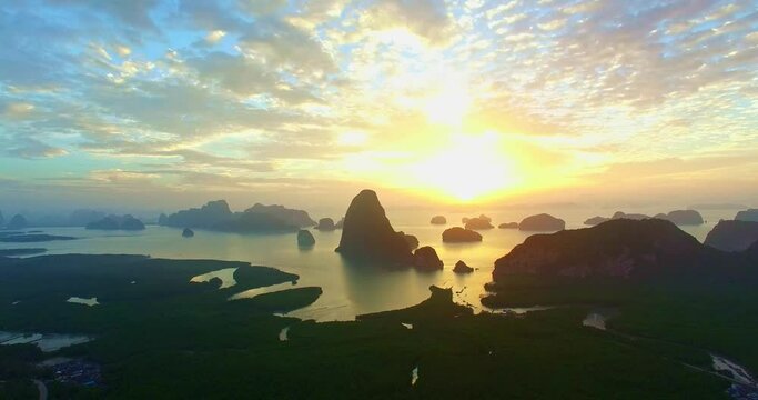 .aerial view Amazing light of nature cloudscape sky above Samed Nang Chee Phang Nga archipelago. .Imagine a fantasy bright red sky at sunrise from drone view..fantastic sky background.