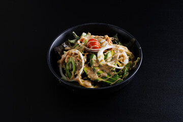 Japanese salad isolated in black background