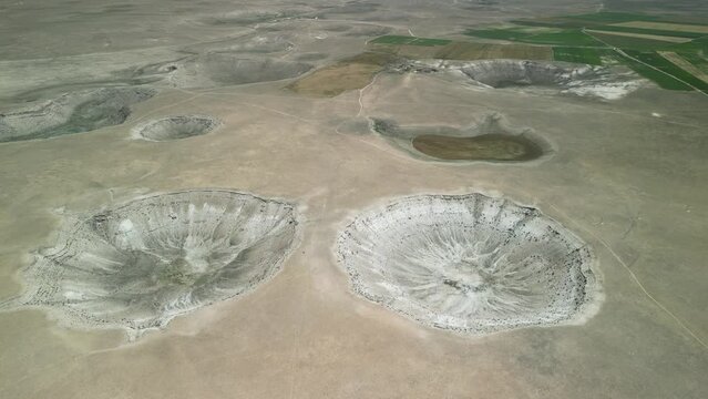 Drone footage of sinkhole formations, deep valleys, natural scenery on Earth. Erosion and the environment. Konya Karapinar district